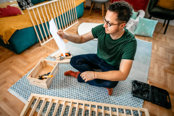 istock Assembling the crib for newborn baby 1273389477