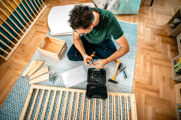 istock Assembling the crib for newborn baby 1273389480