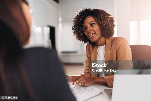 Young Woman Doing A Job Interview Stock Photo - Download Image Now - Job Interview, Interview - Event, Discussion