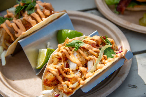 Fish tacos on a plate at an outdoor restaurant