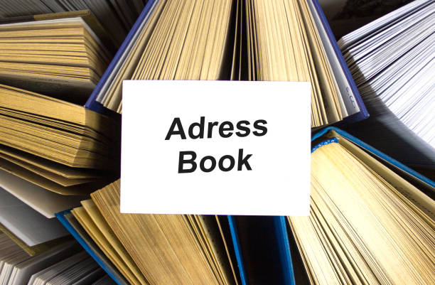 istock Adress books written in white note on open books 1273397047