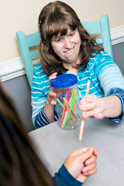 istock Young adult smiles as she successfully works toward her IEP goal while homeschooling 1273399607
