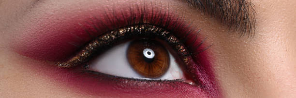 istock Close-up beautiful female eye decorated with makeup 1273400595