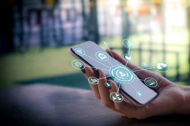 istock Internet of things Futuristic ai technology with virtual icons interface concept, cloud, social media and big data on blurred business woman working with laptop computer at home background. Social distancing 1273407994