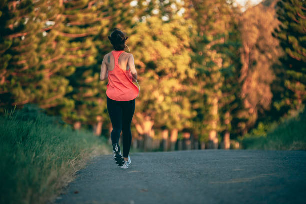 istock Asian woman exercising in the park 1273411178