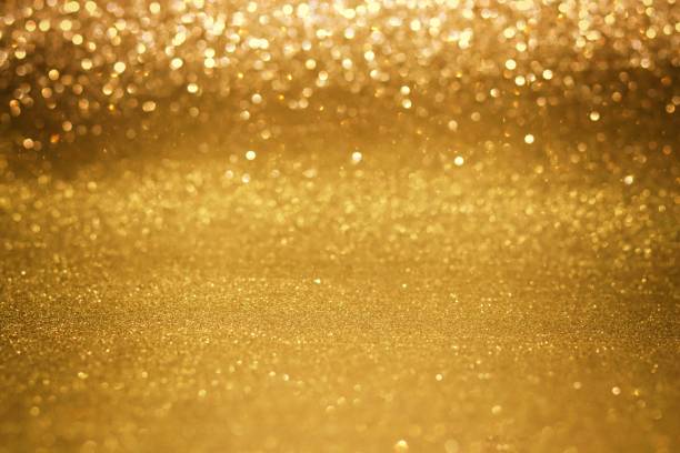 istock Gold bokeh lights defocused background 1273417407