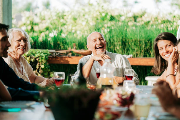 istock Happy multi-generational family at dining table 1273422771