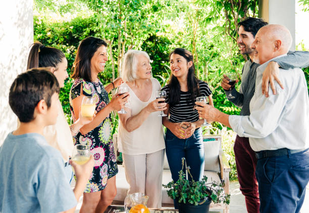 istock Happy family with drinks at patio 1273422840