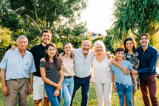 istock Happy extended family standing in backyard 1273423545