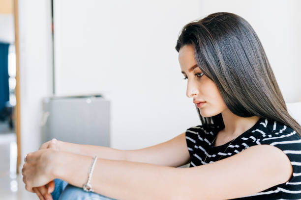 istock Sad thoughtful woman sitting in bedroom 1273423679