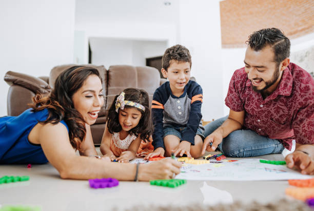 istock Creative Latin parents drawing with children at home during covid-19 quarantine 1273424711