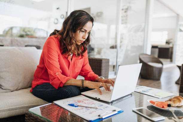 istock Mature Hispanic businesswoman working from home during covid-19 quarantine 1273424801