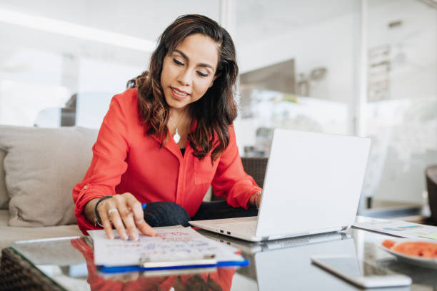 istock Mature Hispanic businesswoman working from home during coronavirus quarantine 1273425412