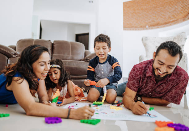 istock Creative Latin parents drawing with children at home during covid-19 quarantine 1273425441