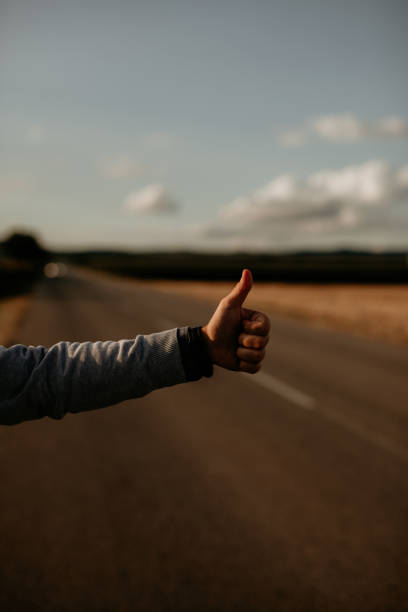istock Hitchhiker male with thumb up 1273425894