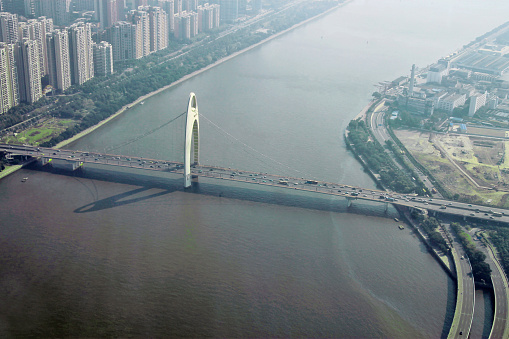 Guangzhou and bridge over Pearl river view from windows of Canton tower China republic