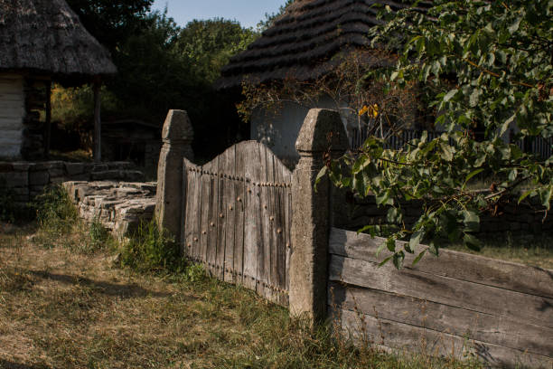 an old wooden fence with a wicket