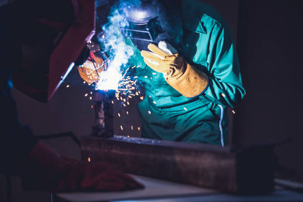 istock Metal welding steel works using electric arc welding machine 1273437517