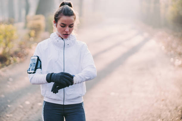istock Sportswoman checking pulse on smartwatch 1273437627