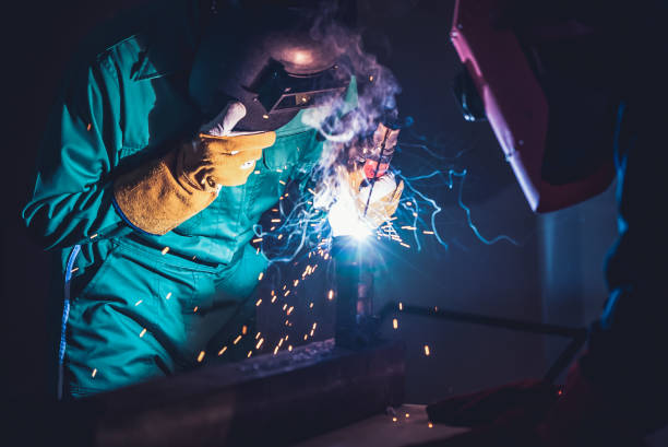 istock Metal welding steel works using electric arc welding machine 1273437766