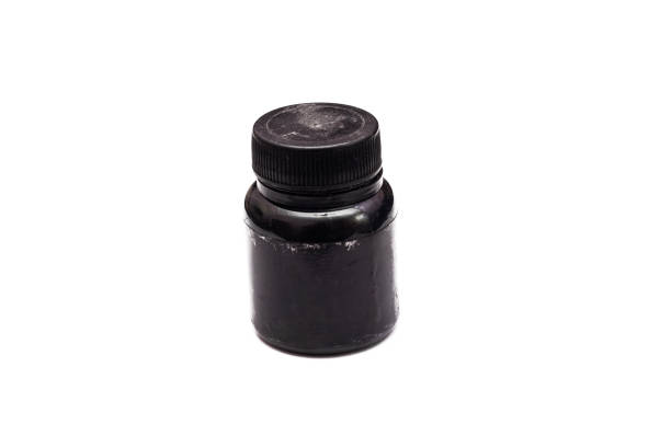 istock Old jar with black paint close up, isolated 1273438388