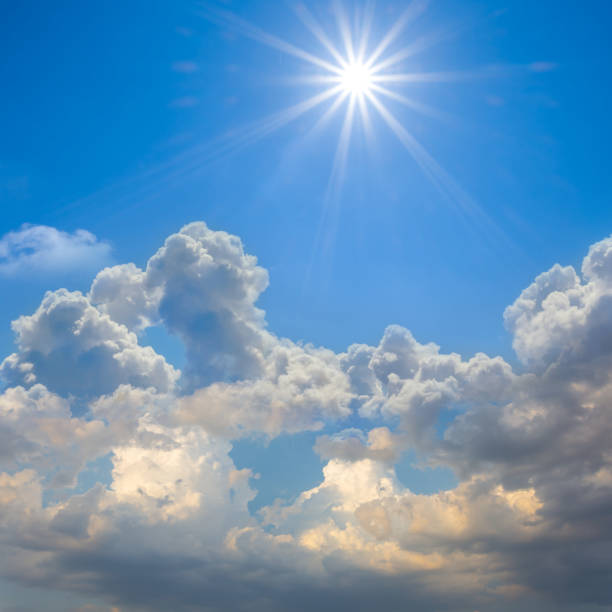 istock sparkle sun over a dense cumulus clouds, blue sky natural background 1273439776
