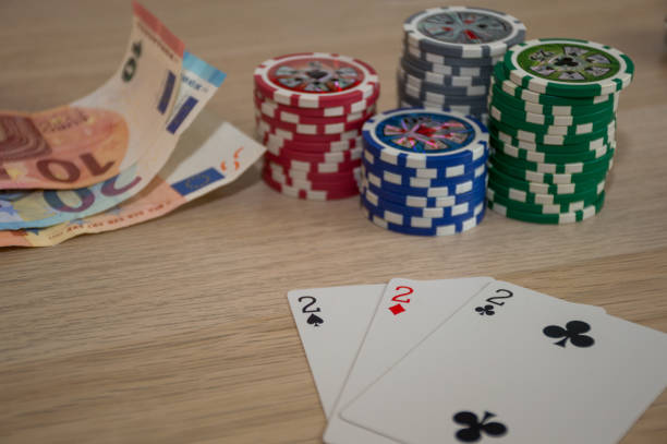 istock playing cards and poker chips on table background 1273440713