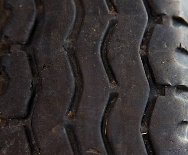 istock Worn old black rubber tire from a truck, close-up. 1273446069