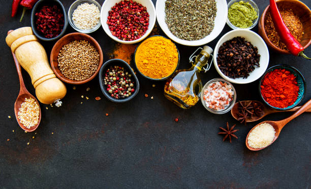 istock Assortment of spices on black 1273446960