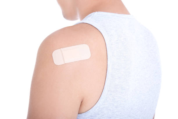 istock medical adhesive patch on male shoulder isolated on white 1273447093