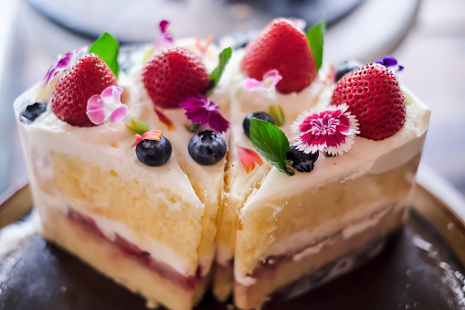 Cheesecake with  fresh strawberry served in restaurant or cafe.