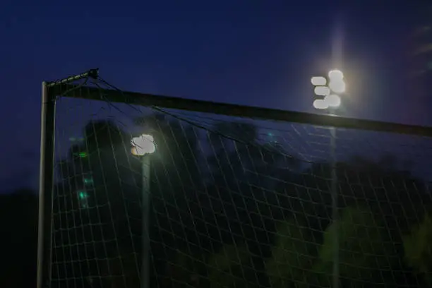 Goal and net in football stadion with old flood light like in ancient days