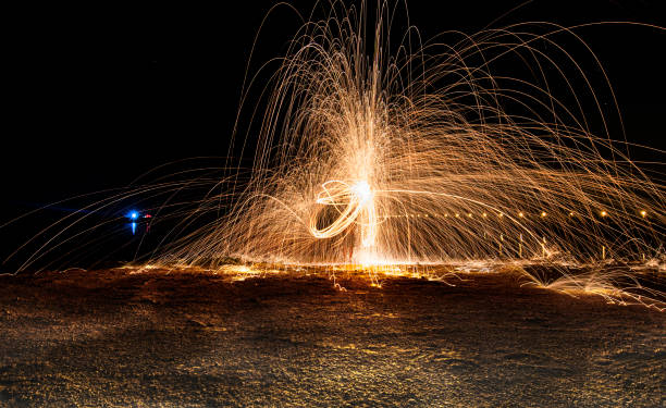 istock firework of steel wool style, it was difficult to achive this design but still got it after few attempts, done in  adesert near dubai,UAE 1273448924