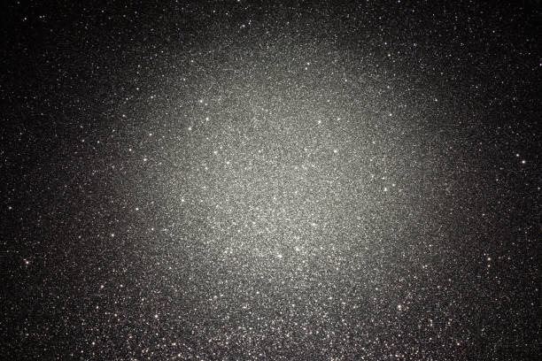 istock Black texture with micro-relief and glitter. Black glitter texture with illuminated center 1273448955