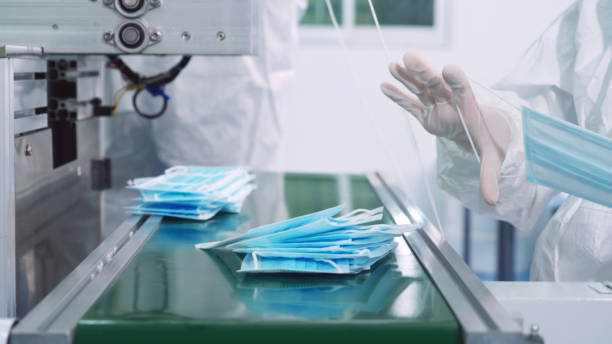 istock Face mask production line in modern factory 1273452392