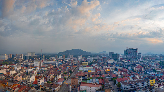 Pandora aerial view of Ipoh city in Malaysia with rows of shops with local restaurants with morning sky