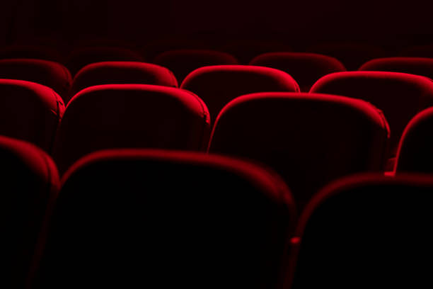 istock Empty cinema hall with red seats. Movie theatre 1273455678