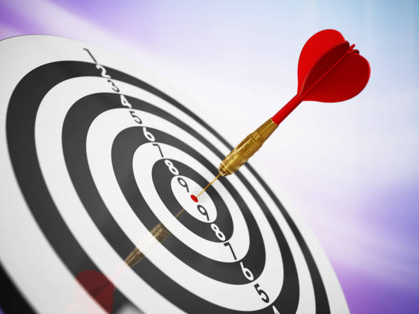istock Red dart hit on the bulleye of a dartboard 1273459976