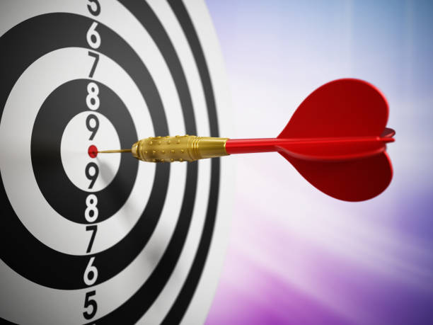 istock Red dart hit on the bulleye of a dartboard 1273460004