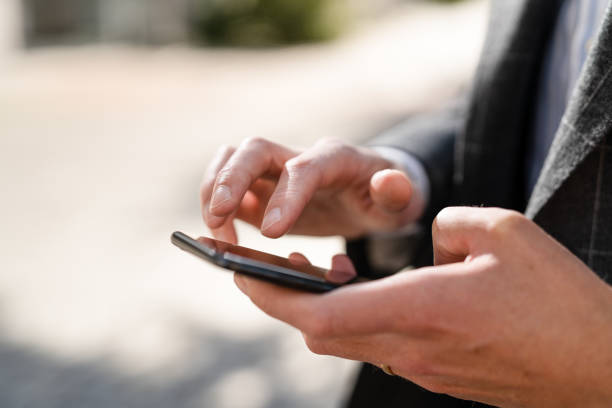 istock Entrepreneur checking email on smart phone 1273462516