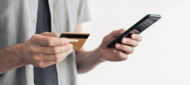 istock Man shopping online using smart phone 1273465892