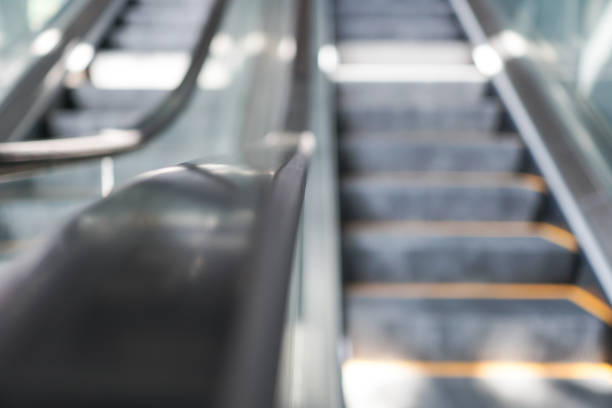 istock Close up on escalator in commercial building. The object is on the left. The escalator is going down. 1273465946