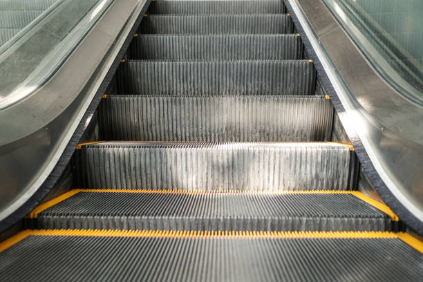 istock Close up on escalator in commercial building. The escalator is going up. 1273465969