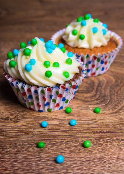 istock two sweet cupcakes with butter cream 1273467948