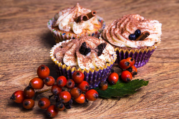 istock three sweet cupcakes with butter cream, cinnamon and rowan berry 1273467950