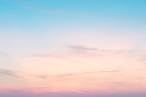 sunset background. sky with soft and blur pastel colored clouds.  gradient cloud on the beach resort. nature. sunrise.  peaceful morning. Instagram toned style stock photo
