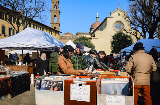 Florence, Italy - February 11, 2018: Traditional flea market in Santo Spirito square in Florence, Italy, on february 11, 2018, with second hand vintage objects