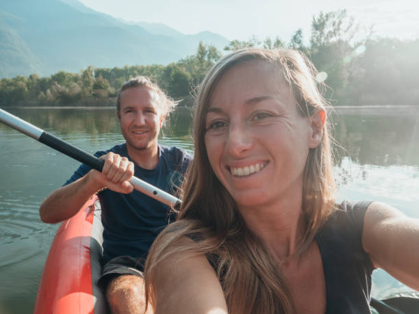 istock Couple take selfie on inflatable canoe in Switzerland 1273474064