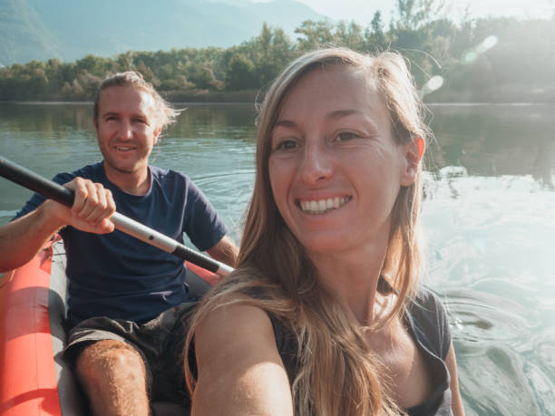 istock Couple take selfie on inflatable canoe in Switzerland 1273474199