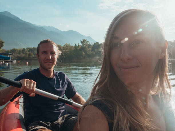 istock Couple take selfie on inflatable canoe in Switzerland 1273474255